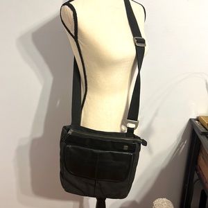 Tumi leather and canvas shoulder bag slightly used